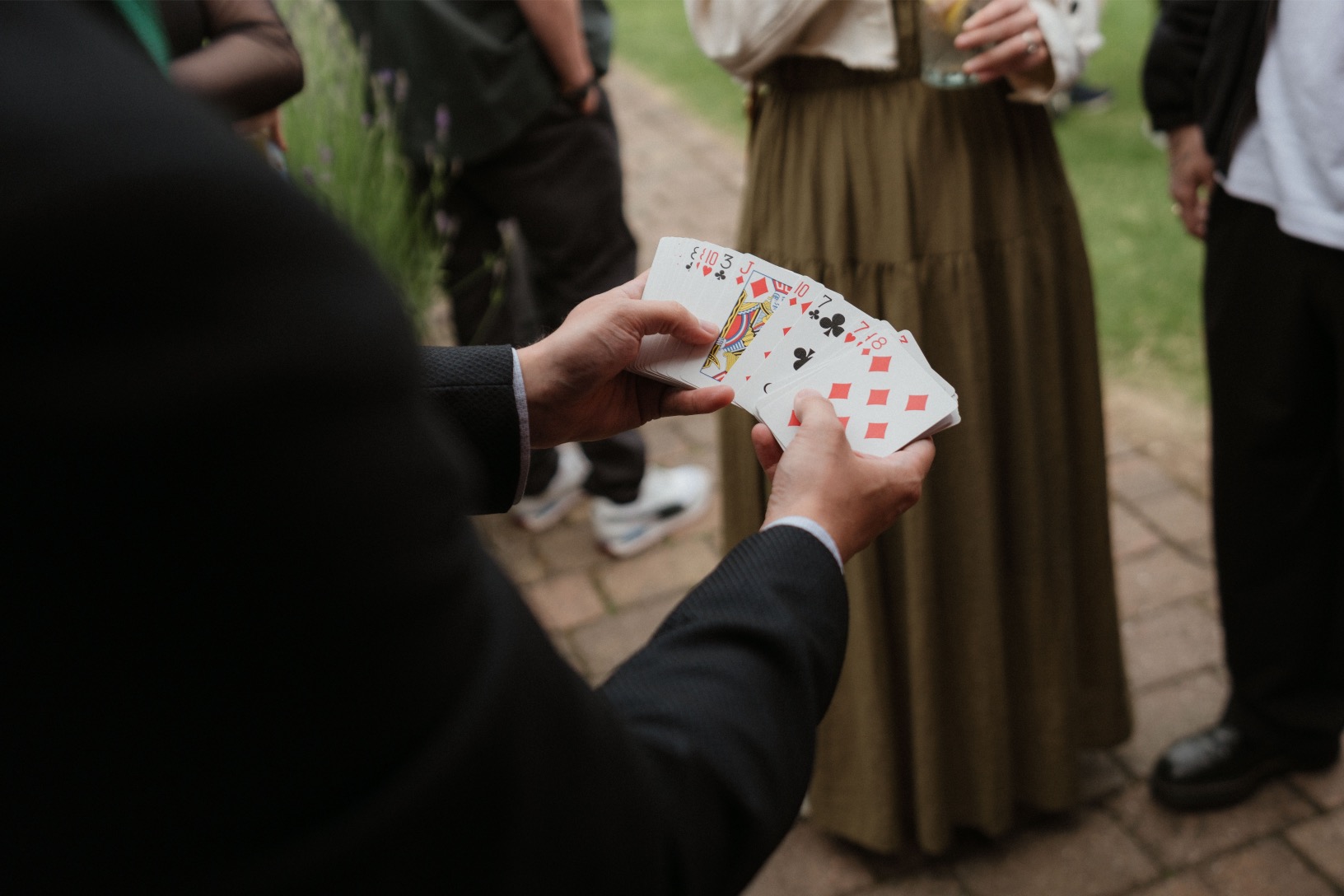 Close-up magic entertaining a group