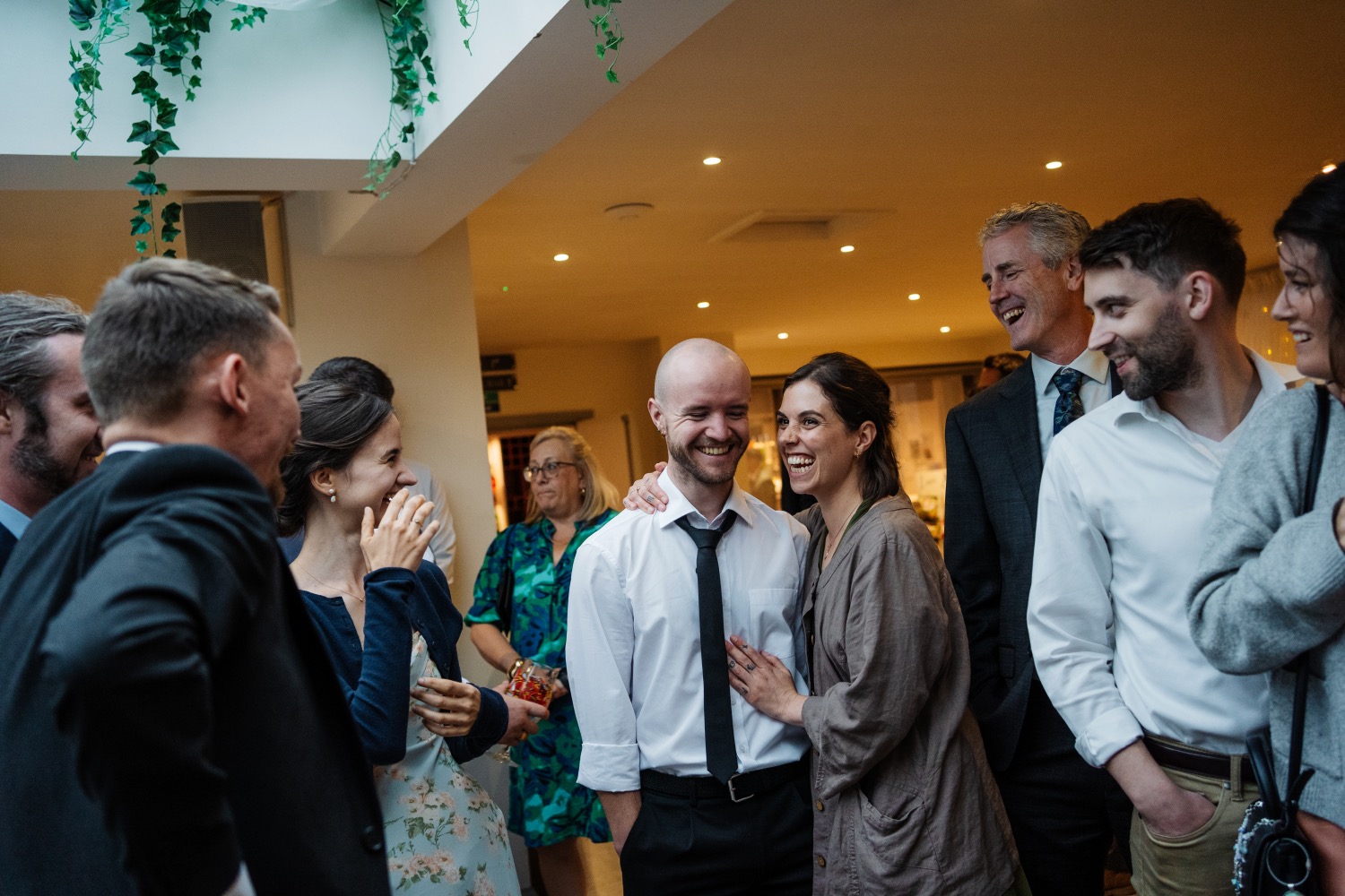 Guests gathered around a magic performance