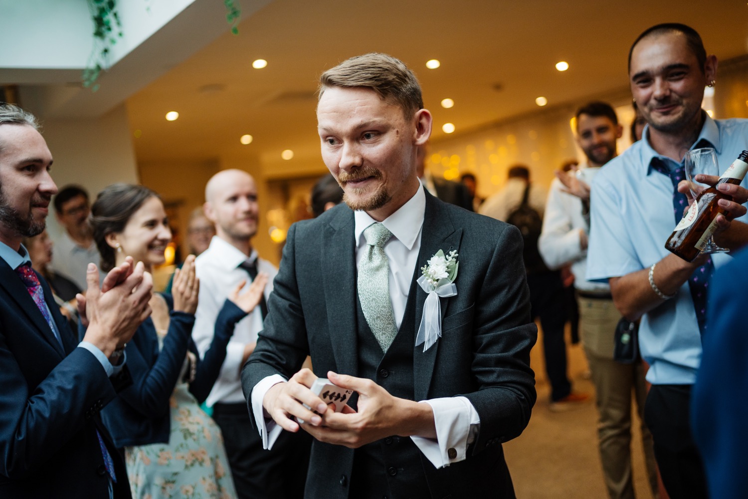 Ryan Beck performing close-up magic for wedding guests