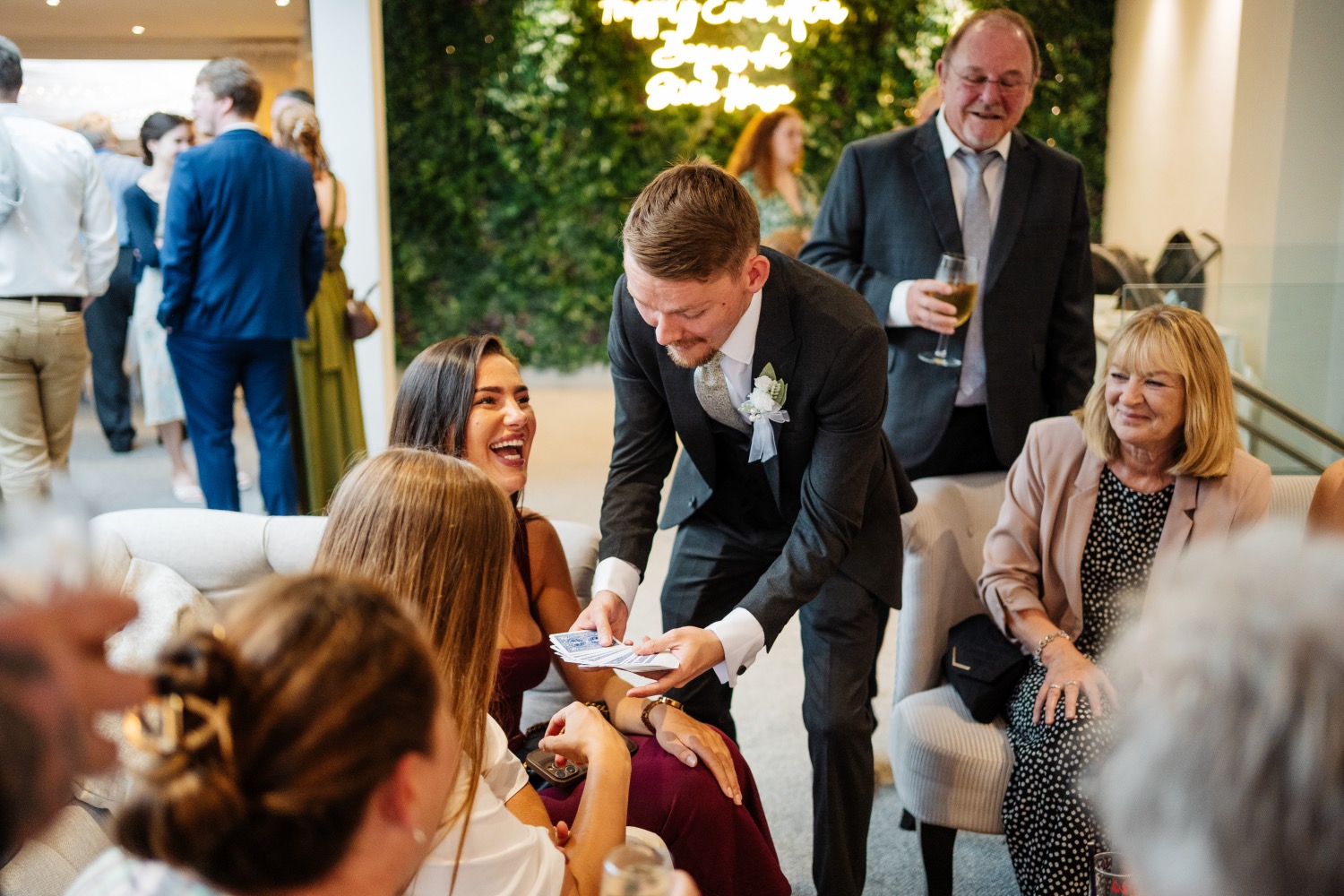 Guests laughing during close-up magic